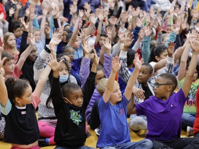 Black Fox students hands up