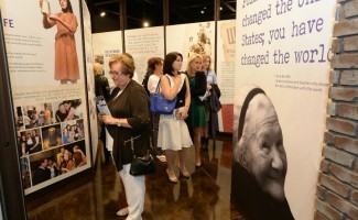 Guests explore the exhibits at the new Center for Unsung Heroes 720x480