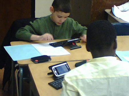 Students in Roni Gold’s fifth-grade classroom use Personal Digital Assistants, or PDAs, to improve grades in reading, writing, math and other subjects.