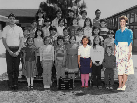 Who is that pretty girl in the pink tights? She is Moua-Carroz in third grade. Her beloved teacher Ms. Spolsdoff, who never stopped believing in her, is on the right.