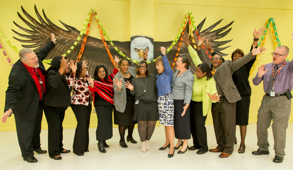 Amara Alexander veteran Milken Educators hands in air 1000w