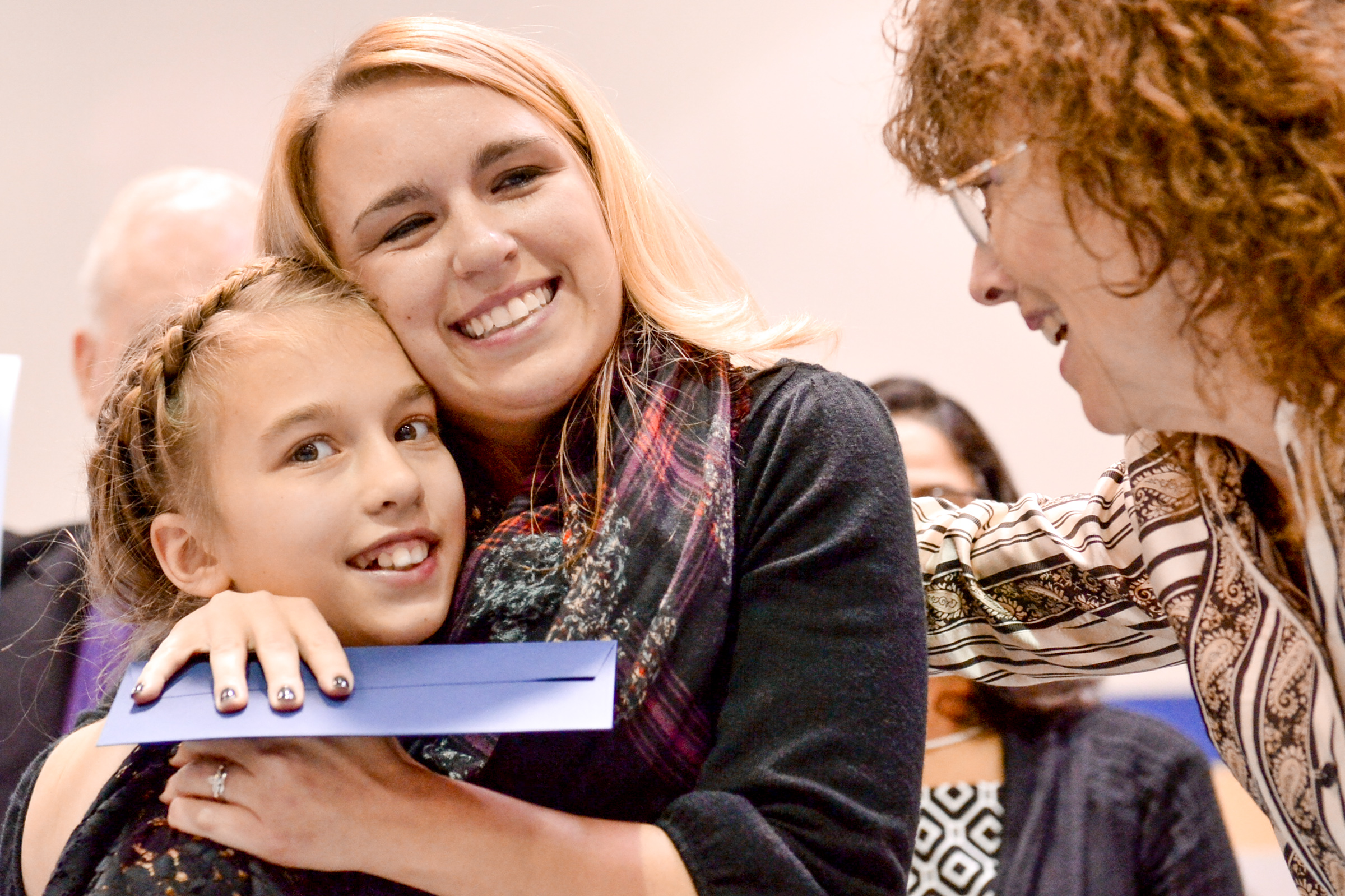 Angela Harvala hugs her daughter, Aubrey.