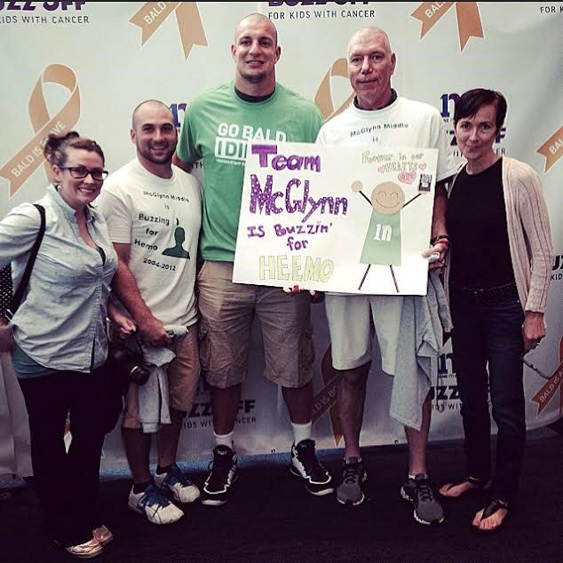 Anthony Petrelis and members of Team McGlynn pose with NFL football star Rob Gronkowski