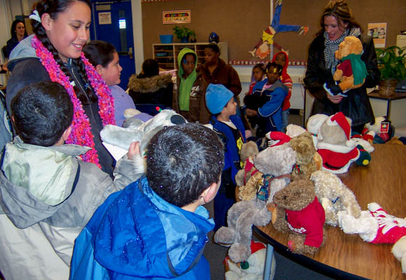 Students and families participate in a holiday event hosted by a local donor.