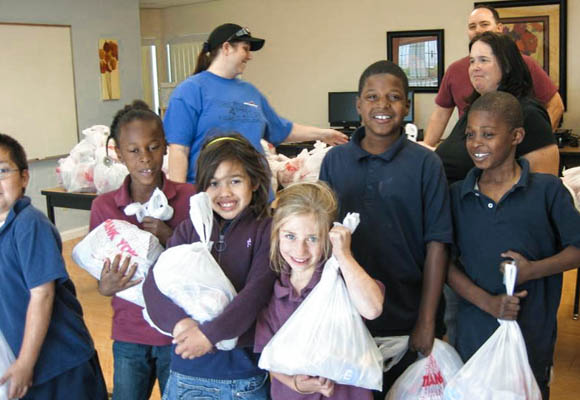 Students are receive their weekend snack bags. Distributed to at-risk students to provide food over the weekend, snack bags are sponsored by Serving Our Kids and Three Square.