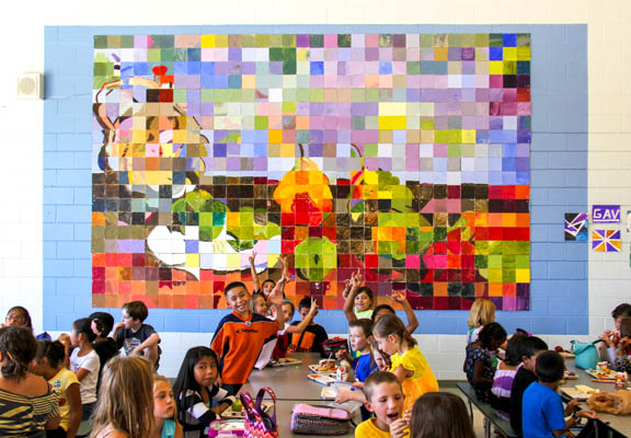 With the school exteriors completed, Barth and students have been working on the interiors, such as this recent mural in the cafe, based on a Cezanne painting.