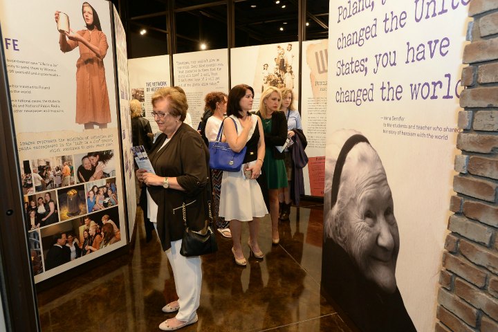 Guests explore the exhibits at the new Center for Unsung Heroes 720x480