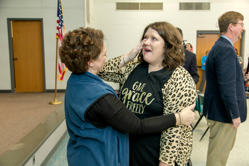 Kara Davis hug from principal 1000w