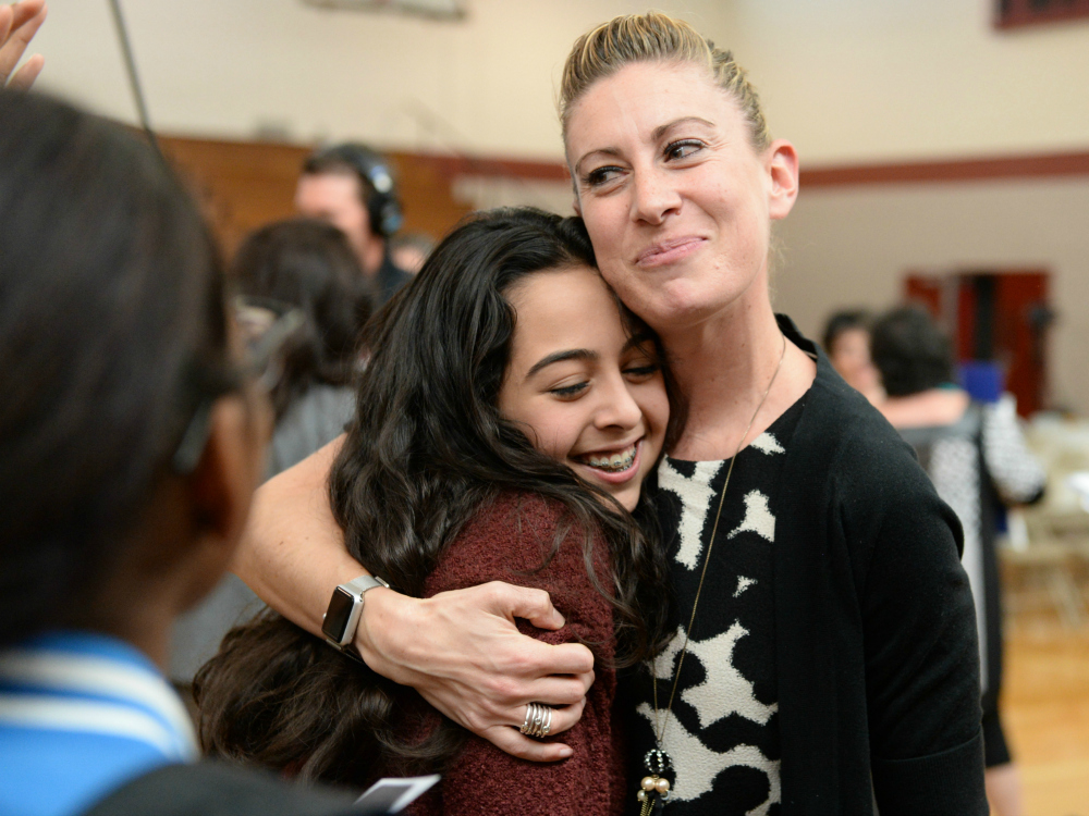 Lauren Jensen hugs student 1000w