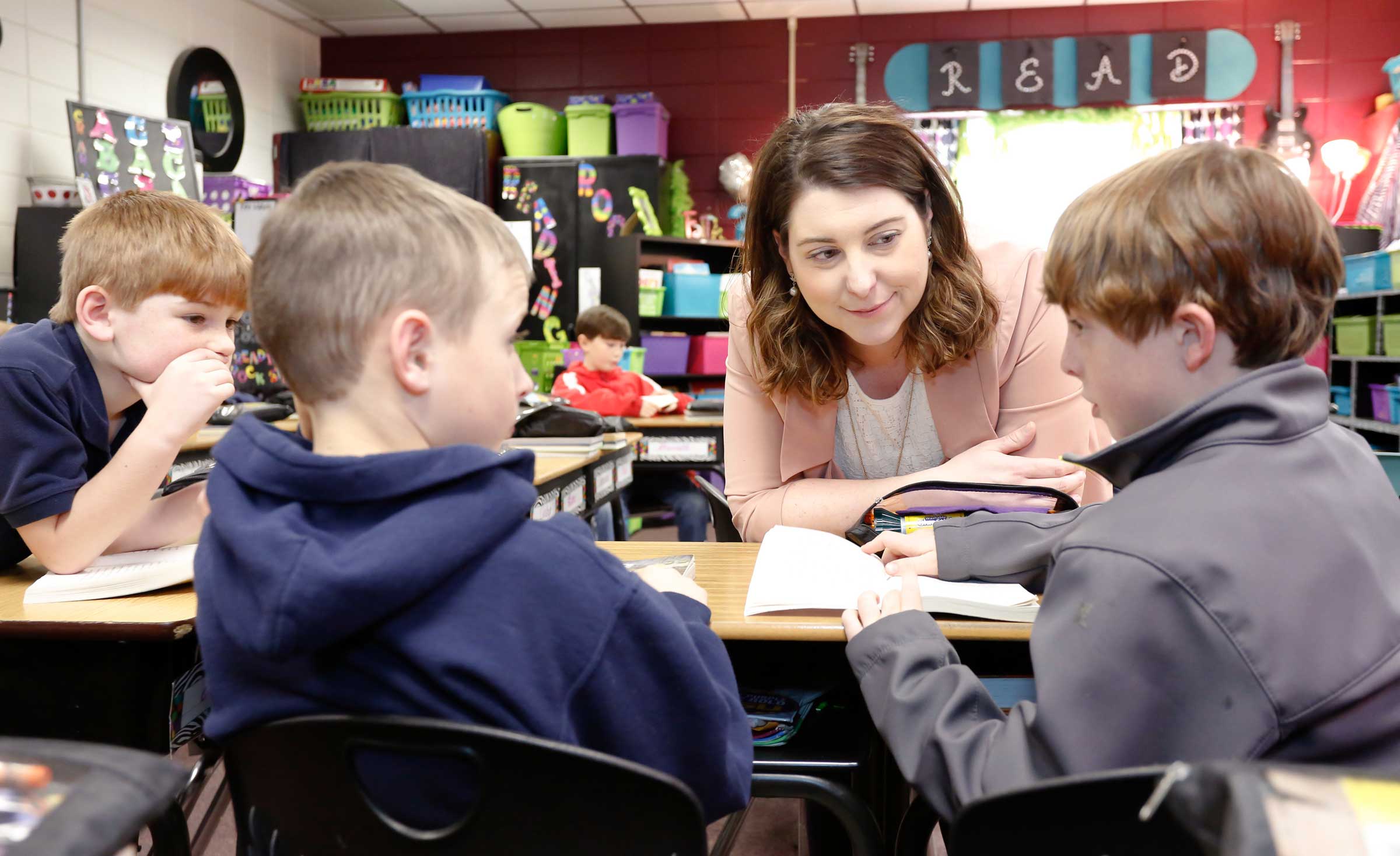 Lindsey Parker helps students with a lesson.