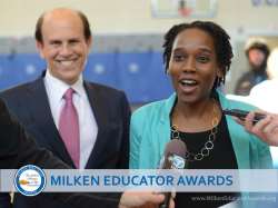 Kena Allison and Mike Milken in front of media